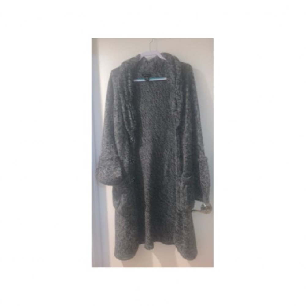 Long sweater with bell sleeves and pockets
